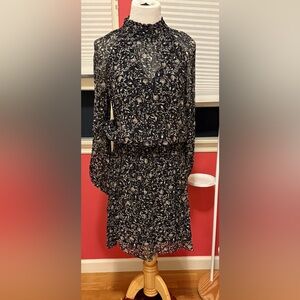 Never worn but tags discarded. Perfect fall dress with boots or flats!